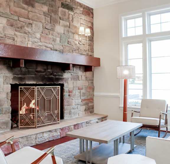 Living room with fireplace at Broadlands Apartments, Ashburn, VA